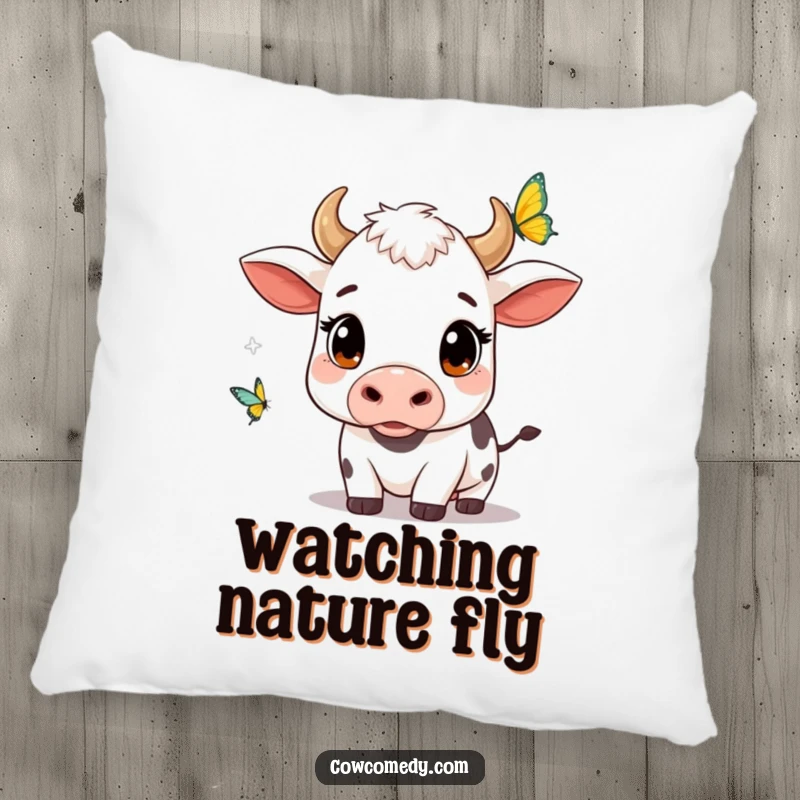 Funny kawaii cow pillow with wide, curious eyes watching a butterfly, offering comfort and a charming display of wonder.