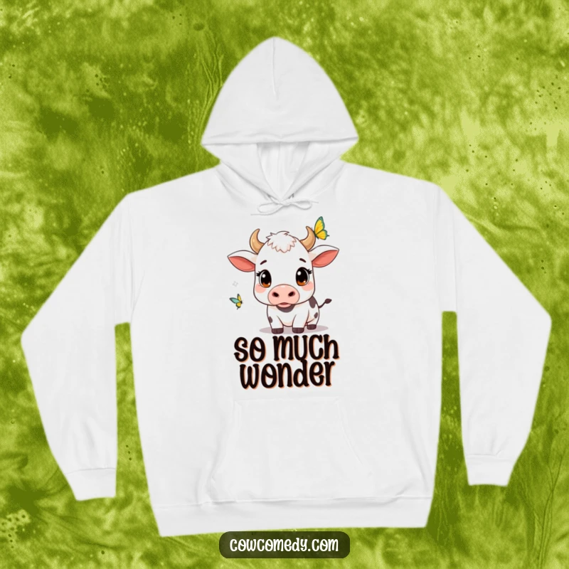 Funny kawaii cow hoodie with wide, curious eyes, observing a butterfly, offering warmth and a touch of whimsical wonder.