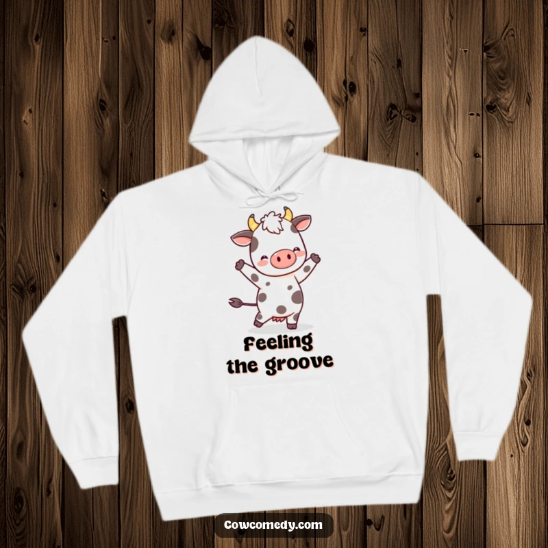 Funny Kawaii Cow Hoodie: a spotted character performing a happy dance, offering warmth and a touch of whimsical, humorous delight.