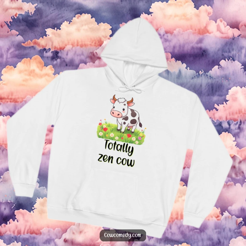 Funny cozy hoodie featuring a contented cow grazing peacefully in a meadow, offering warmth and serene farm humor.