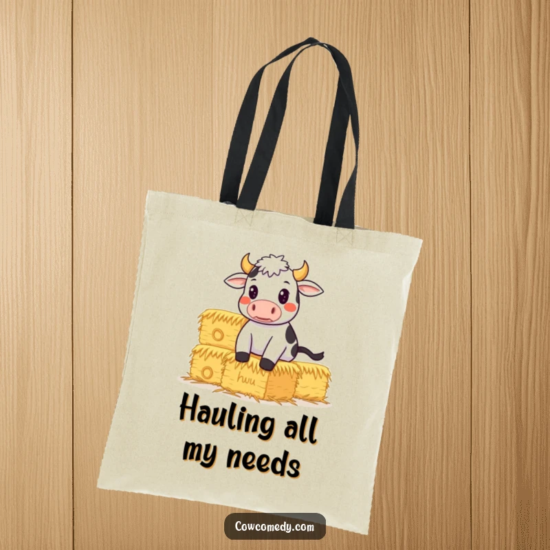 Funny Tote Bag featuring a determined cow balancing a stack of hay bales, symbolizing strong effort and humorous drive.